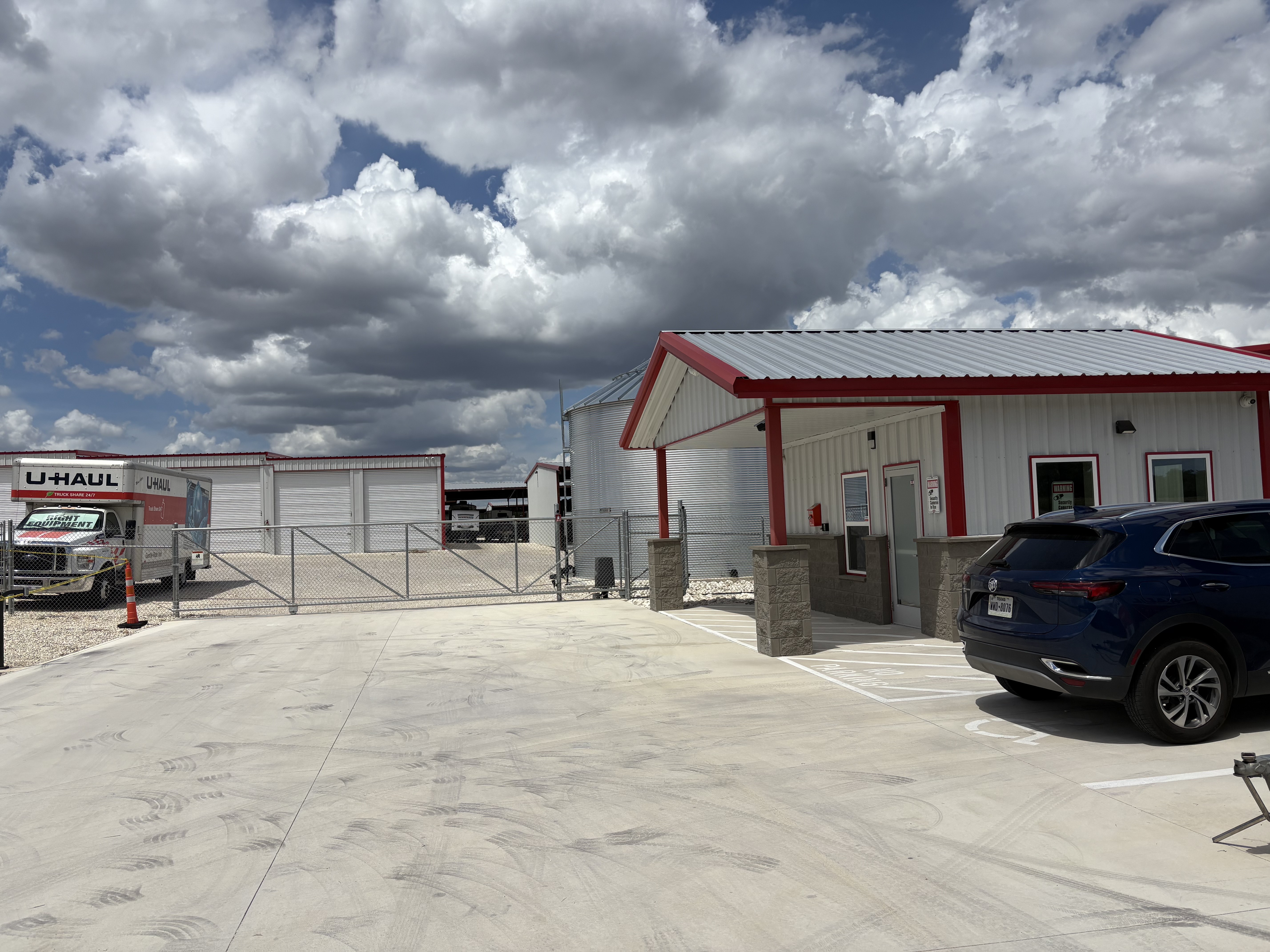 Covered boat storage facility near Bulverde, Texas with secure gated access and wide aisles for trailers and watercraft